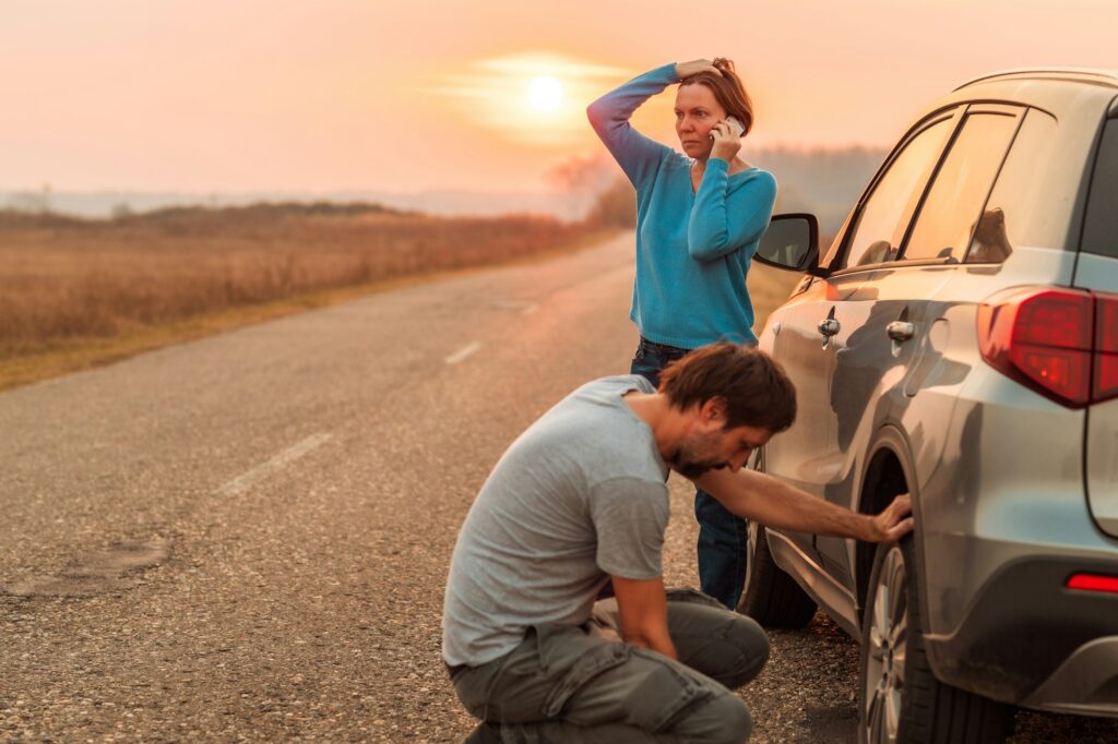 C.A.R Towing fixing a punctured tire in Valley Stream, Long Island, NY.